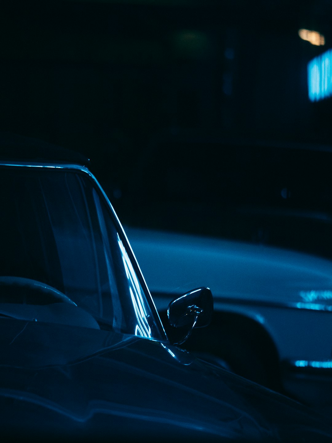 black car in a dark room